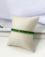 Pulseira-Folheada-Dourada-Riviera-Baguete-Verde.jpeg